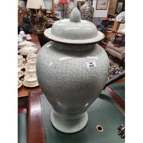 635 - The property of The 5 star Hotel in London. A large lidded Urn with crackle effect. 52 cms H.