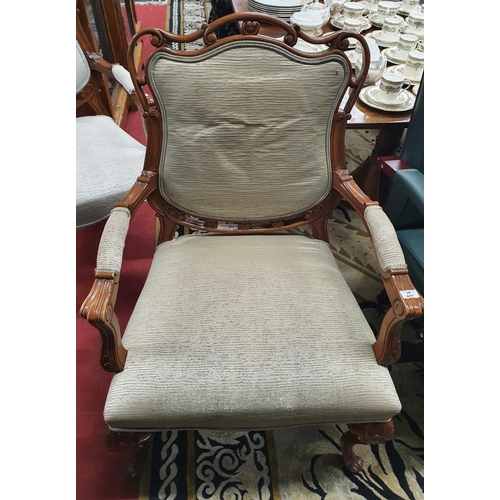 637 - The property of The 5 star Hotel in London. A good Hardwood Armchair with upholstered back and arms ... 