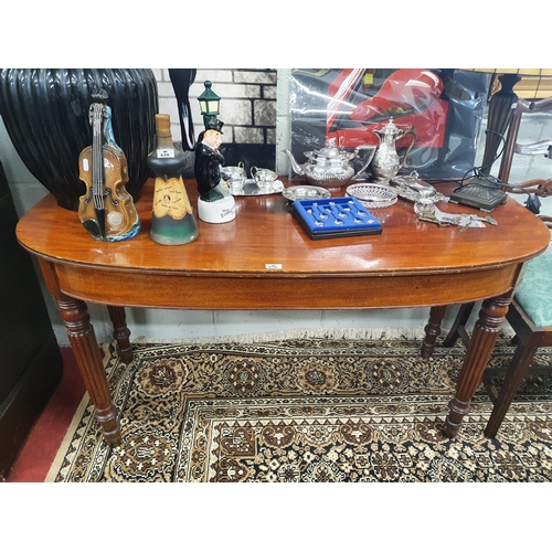 650 - A Georgian Mahogany half moon Side Table in the manner of Gillows with reeded supports. 138 x 66 x 7... 