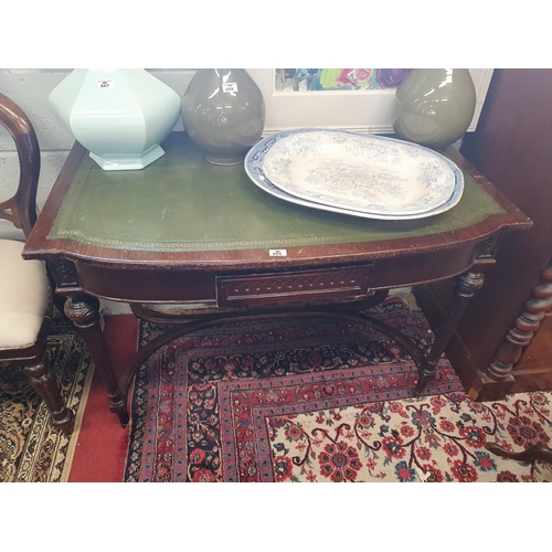 665 - A 19th Century Mahogany Veneered Side Table with a leather insert top.