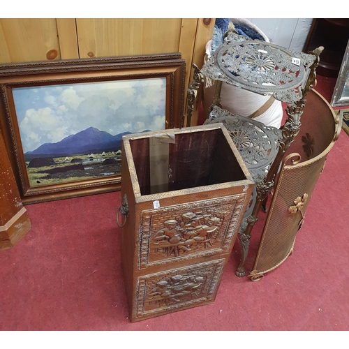 923 - A Brass three tier Plant Stand, a stick stand along with two Paul Henry coloured prints.