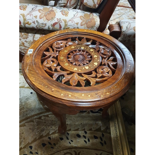 935 - A 20th Century Hardwood and Brass Circular wheel shaped Table. 53 cms diam.