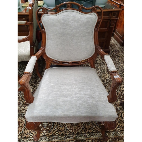 638 - The property of The 5 star Hotel in London. A good Hardwood Armchair with upholstered back and arms ... 