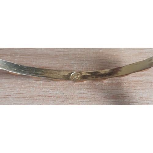 557 - A continental gold Bangle. approx 11gms.