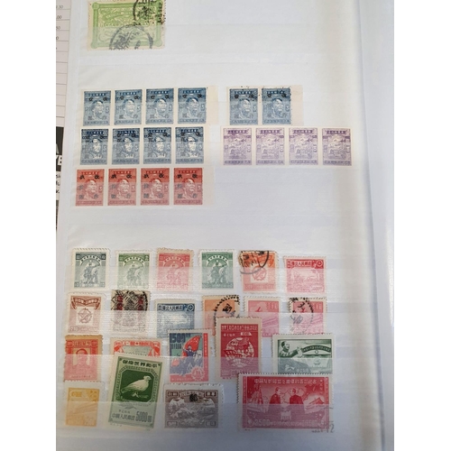 583b - A large stock book of Chinese Stamps.