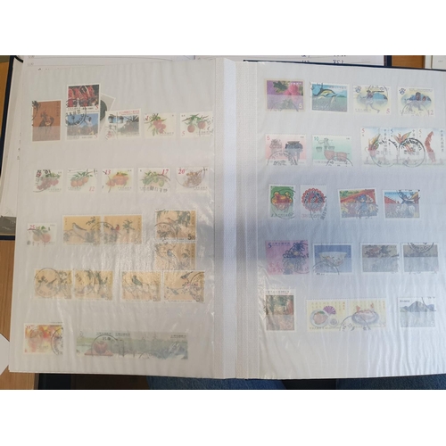 583b - A large stock book of Chinese Stamps.