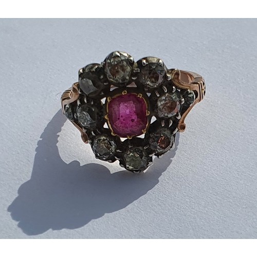 13 - An early Victorian Ruby and Diamond cluster Ring set in rose gold. Approx diamond weight 1.5 - 2cts.... 