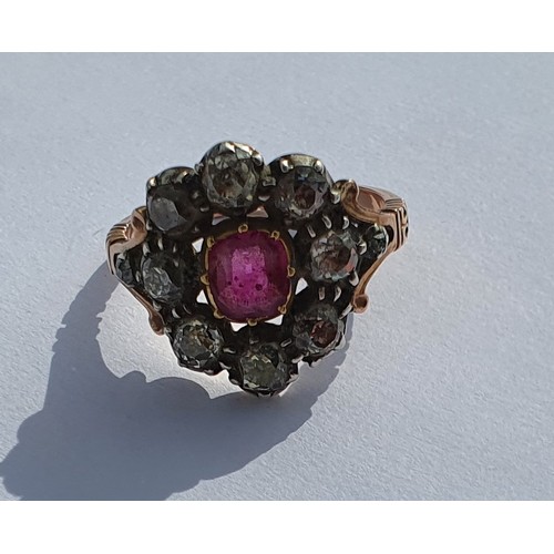 13 - An early Victorian Ruby and Diamond cluster Ring set in rose gold. Approx diamond weight 1.5 - 2cts.... 