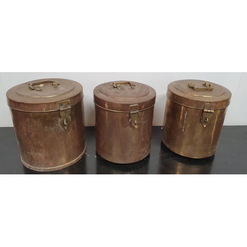 130 - Three Brass/Copper lidded Pots.25d x 28h cms.