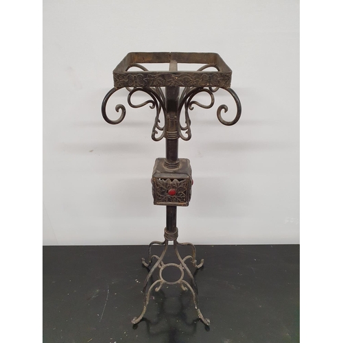 141 - SILK ROAD: A Metal Stand. 80h .Top 21x 21 cms.