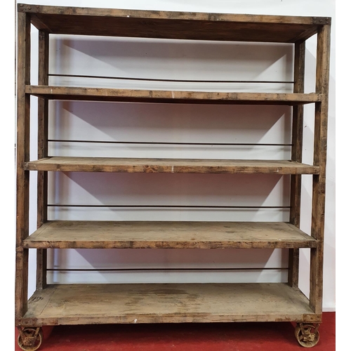 69 - A very large open Shelving on wheels.188w x 46d x 207h cms.