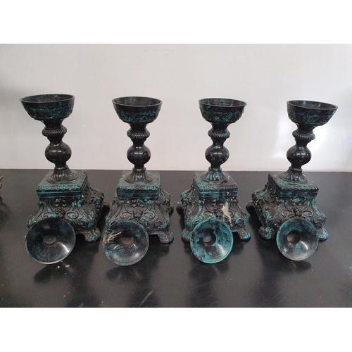 169 - SILK ROAD: Four Metal Candlesticks.26h cms.