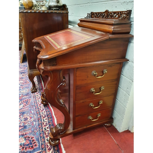 450 - A Mahogany Davenport with red leather tooled inset.55w x 54d x 90h cms.