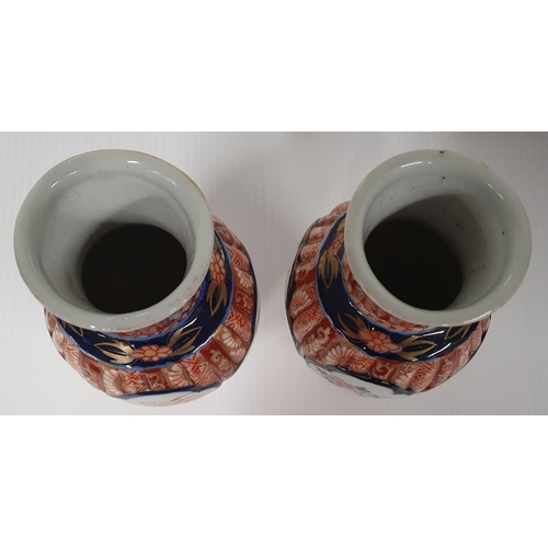 469 - A lovely pair of Imari style vases.18h cms.