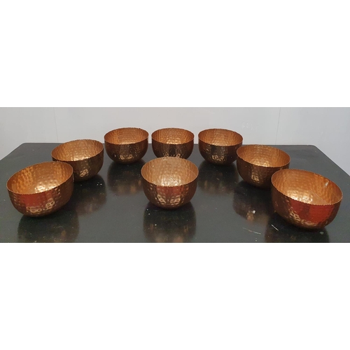 207 - SILK ROAD: A set of eight Copper Bowls.