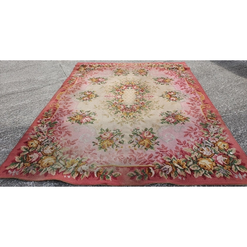 432 - A pair of Navan Carpets with pink ground and floral decoration. 360 x 275 cms each.