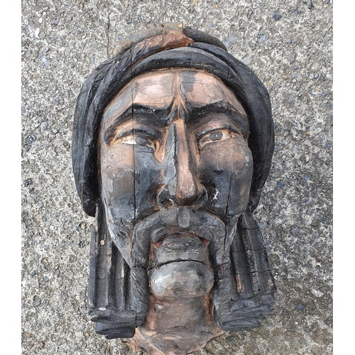 289 - A large Timber Carving of an Indian Chief with large ring handle.