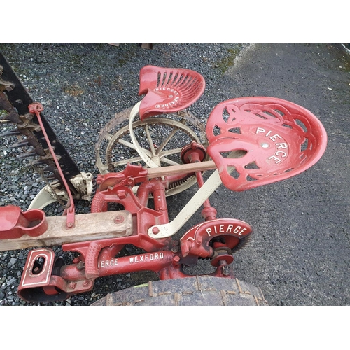 418 - A Pierce of Wexford Moving Bar with two seats, Red and Cream.