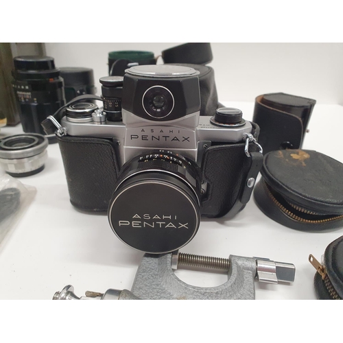 126 - A Pentax Camera and accessories in a metal case.