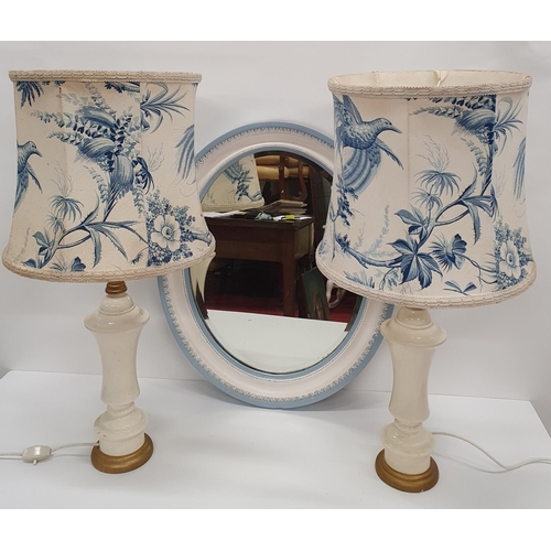 206 - A good set of pottery Lamps along with a 19th Century oval painted Mirror.52 x 61 cms.