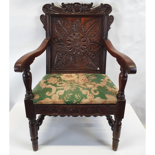 175 - A Superb 19th Century possibly earlier oak provincial Hall Chair with a highly carved back.