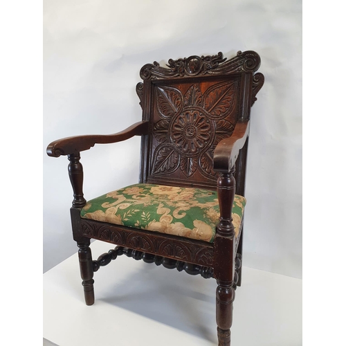 175 - A Superb 19th Century possibly earlier oak provincial Hall Chair with a highly carved back.