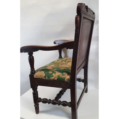 175 - A Superb 19th Century possibly earlier oak provincial Hall Chair with a highly carved back.