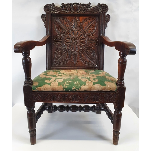 175 - A Superb 19th Century possibly earlier oak provincial Hall Chair with a highly carved back.