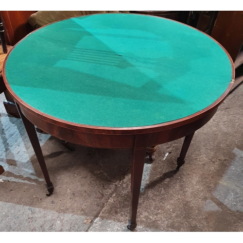 806 - A Georgian Mahogany half moon fold over Card Table on tapered supports.