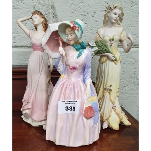 339 - A Royal Doulton Figure 'Miss Demure' HN:402 along with two Regency figures.H 18 cms.