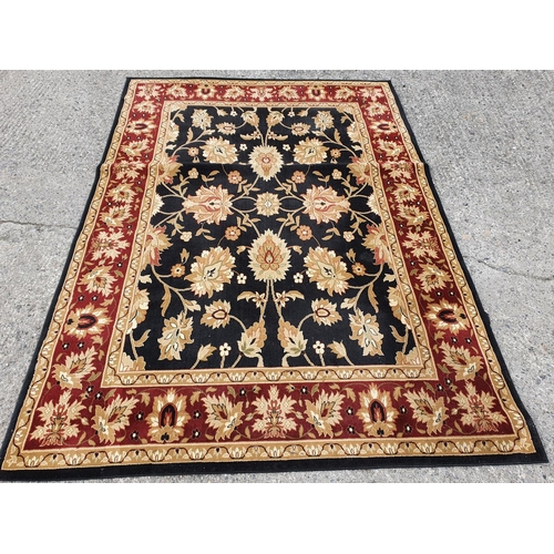 83 - A black and cream ground Carpet with red outline. 285 X 201 cms.