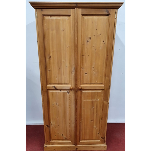 81a - A pine two door Wardrobe. 96w x 192h x 60d cms.