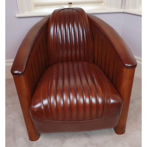 10 - A Fantastic pair of Brown Leather Club Chairs in the Art Deco style with a ribbed upholstered outlin... 