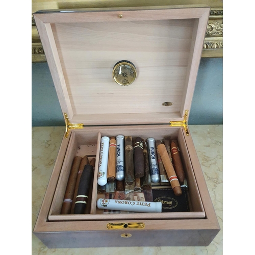 114 - A Mahogany Humidor and contents.