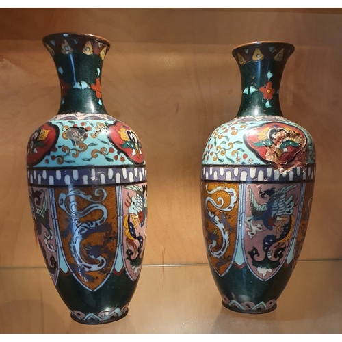 127 - A pair of 19th Century Cloisonné Vases with allover decoration. (slight damage).