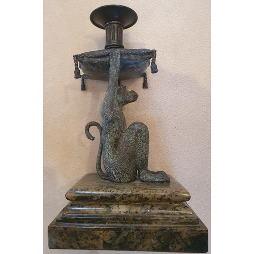 128 - A good pair of Bronze effect Candlesticks in the shape of a Monkey. On marble bases.