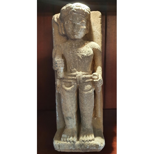 130 - A Stone Figure. 37 cms high approx.