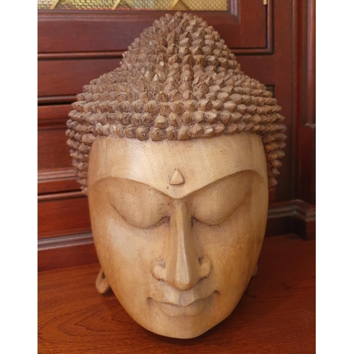 132 - A Buddha Figure. 42 cms high approx along with another.