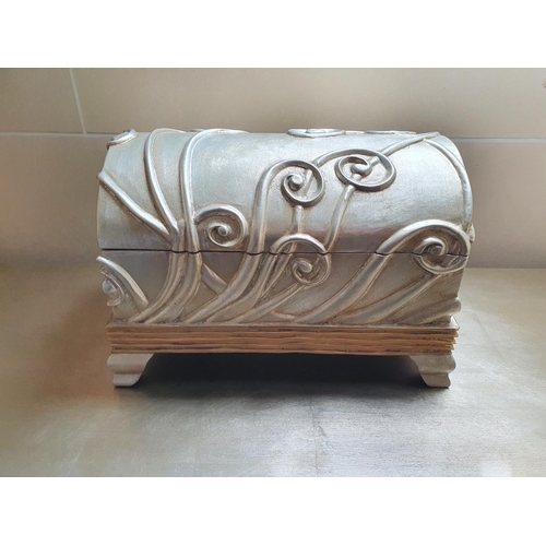 183 - Withdrawn. A Silver Chest with free flowing decoration. 39 cms wide approx.