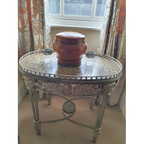 195 - An oval Silvered Metal Table with gallery top. 75 x 56 x H 66 cms approx.