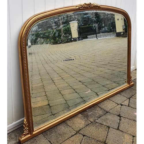 337 - A Gilt Arch top Timber Mirror. 140 x 92 cms approx.