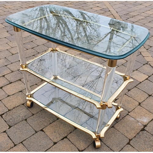 346 - A good Brass and Glass three tier Dumbwaiter on castors. 84 x 71 x 55 cms approx.