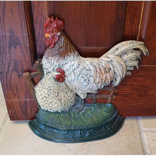 68a - A nice painted Door Stop in the shape of a hen and Cockerel. 32h cms.