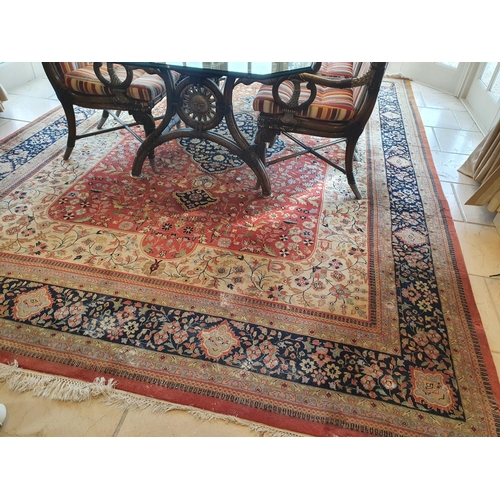 69 - A large Handwoven Kashan Carpet with cream ground multi borders and allover decoration. 380 x 264 cm... 