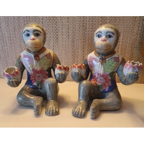 87 - An unusual pair of Oriental Monkeys with painted decoration. 21 cms approx.