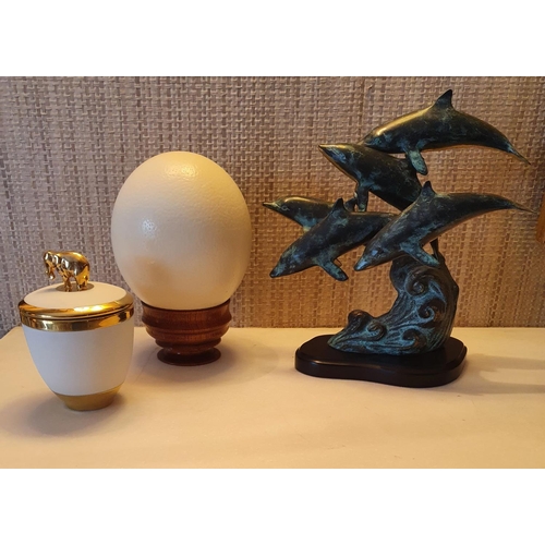 92 - A group of Decorative Items to include San Pacific Inc. Dolphins, an Ostrich Egg and a l'objet Pot.