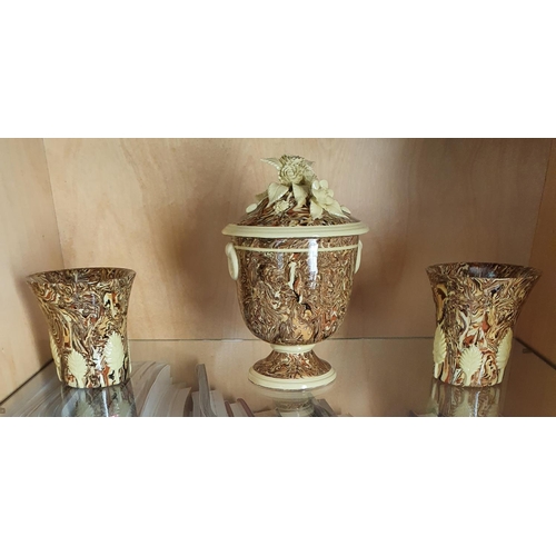 142 - A Ceramic Garniture Set. 19 cms high at centre. approx.