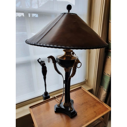 203 - Withdrawn. A fantastic pair of metal and brass Table Lamps with eaglehead moldings 85 cm.