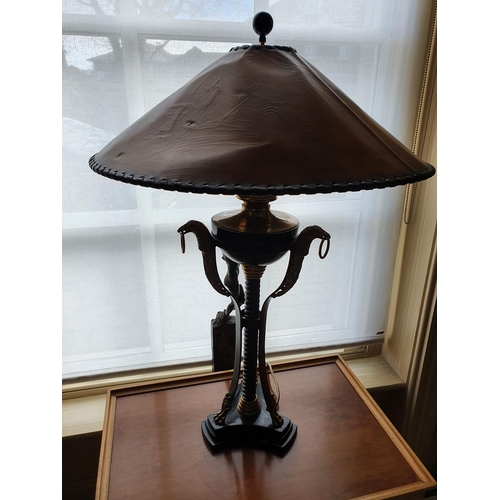 203 - Withdrawn. A fantastic pair of metal and brass Table Lamps with eaglehead moldings 85 cm.