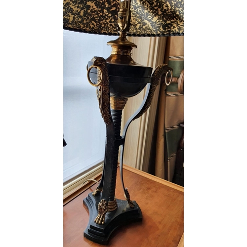 203 - Withdrawn. A fantastic pair of metal and brass Table Lamps with eaglehead moldings 85 cm.